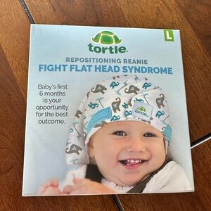 Tortle repositioning beanie for flat head